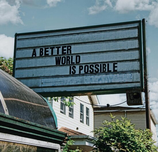 Sign outdoors with the words, "A better world is possible."